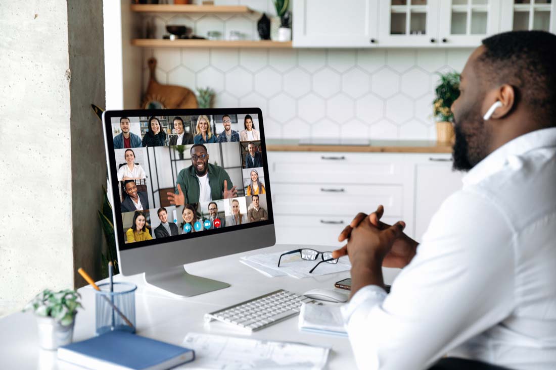 An employee working in a remote work environment on a zoom call.