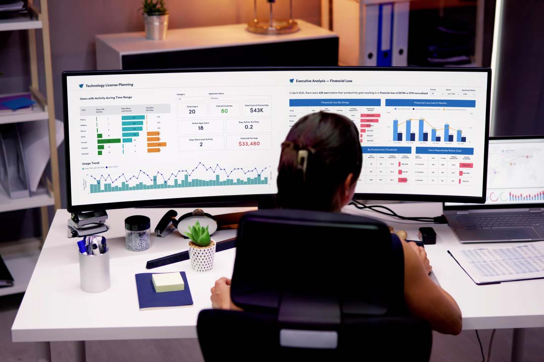 A back-office executive analyzing ActivTrak’s workforce optimization software.