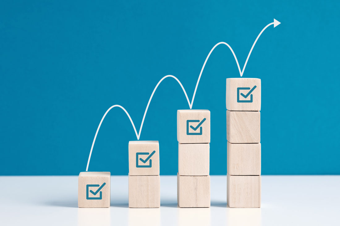 Checkmarks in an ascending order to symbolize employee task tracking.
