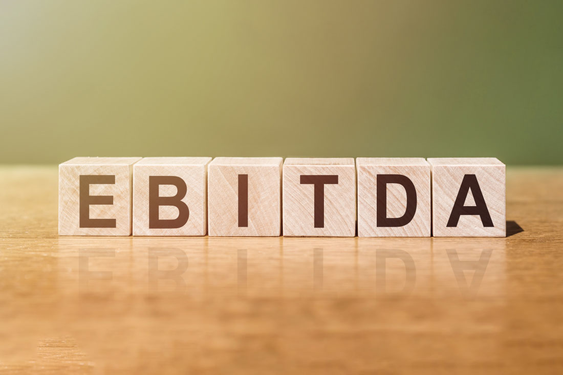 Wood blocks with letters that spell EBITDA.