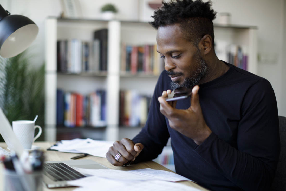 An employee working remotely and collaborating with his remote team using remote work tools.