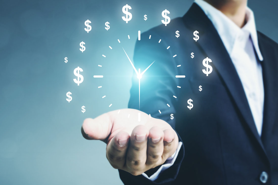 Businessman holding a glowing clock made of dollar signs, symbolizing the value of time and money.